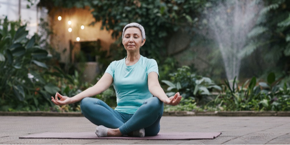 woman sitting cross legged - improve work performance