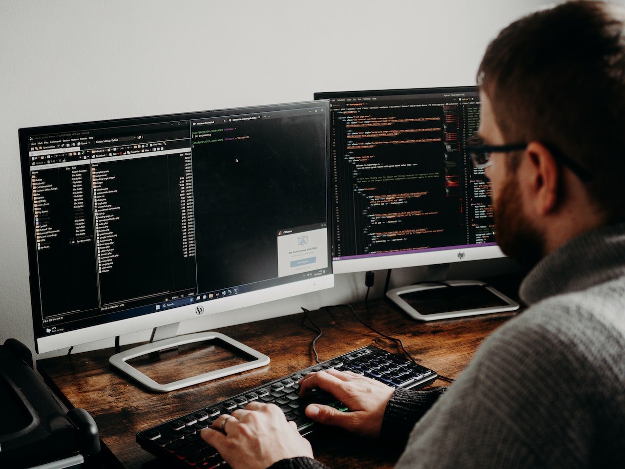man-coding-at-home-using-two-monitors-hard-skills