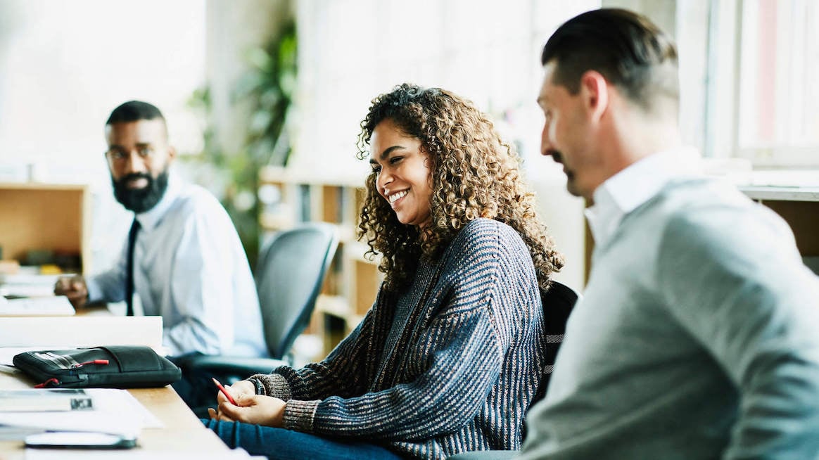 meetings-promote-social-learning-employees-in-person-meeting-in-conference-room
