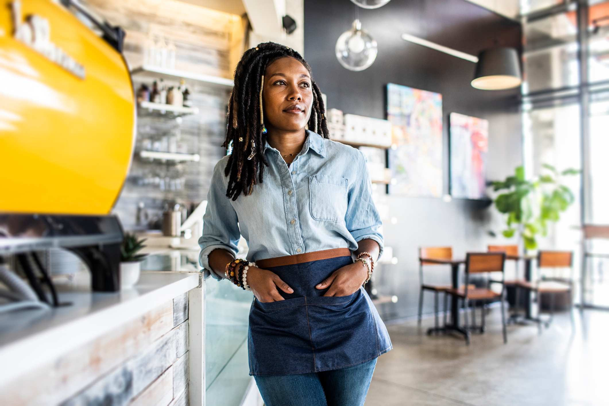 Portrait-of-female-coffeeshop-owner-in-coffeeshop-setting-goals-for-2024