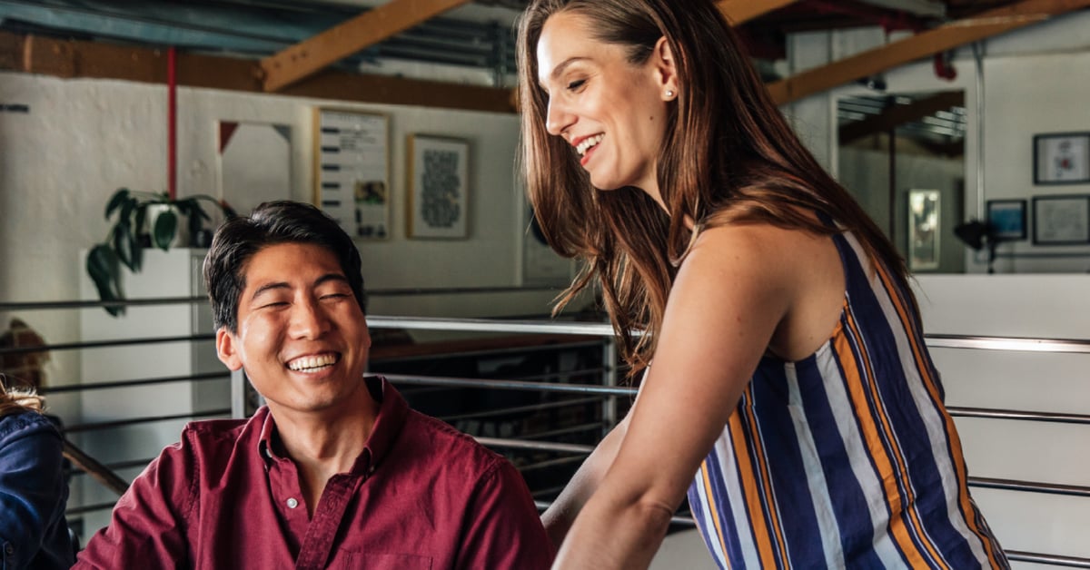 man and woman smiling - what is organizational leadership