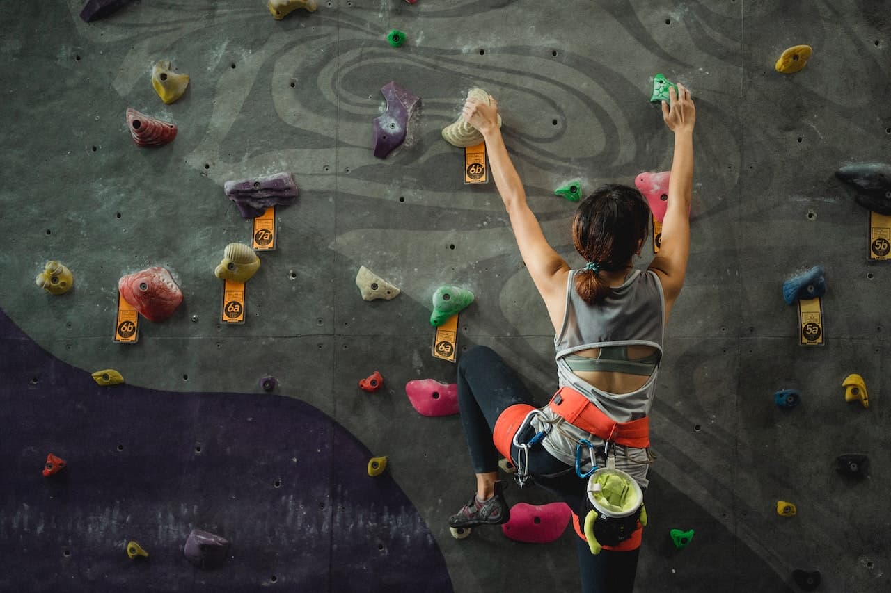 woman-climbing-artificial-wall-life-goals